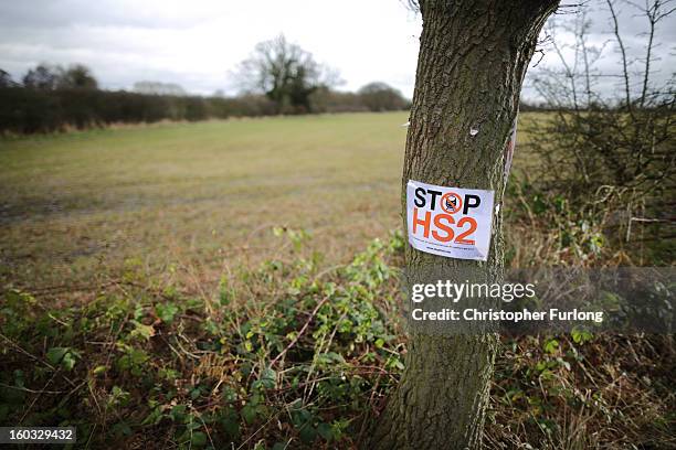 Stop HS2' poster is fixed to a tree in the countryside surrounding the village of Middleton in Staffordshire on January 29, 2013 in Middleton near...