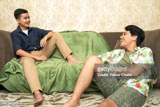 two teenage boys hanging out - chino stock pictures, royalty-free photos & images
