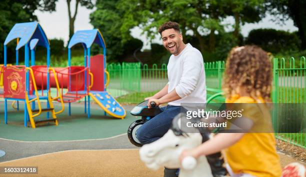 single dad with child - playground stock pictures, royalty-free photos & images