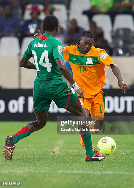 Benjamin Balima from Burkina Faso and Emmanuel Mbola from Zambia in action during the 2013 Orange African Cup of Nations match between Burkina Faso...