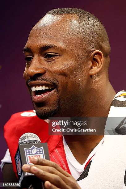 Vernon Davis of the San Francisco 49ers answers questions from the media during Super Bowl XLVII Media Day ahead of Super Bowl XLVII at the...