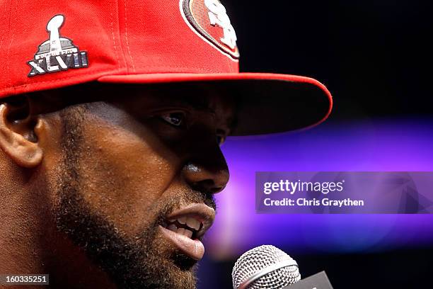 Randy Moss of the San Francisco 49ers answers questions from the media during Super Bowl XLVII Media Day ahead of Super Bowl XLVII at the...