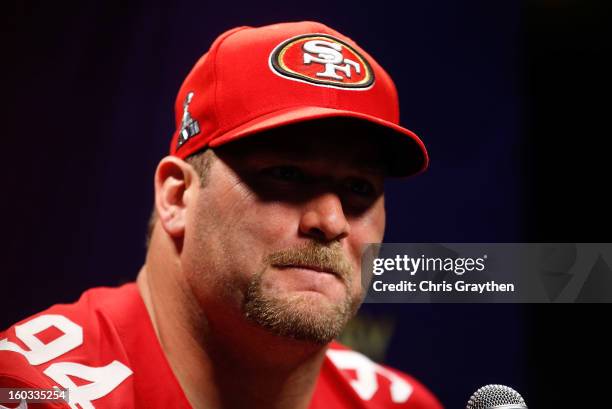 Justin Smith of the San Francisco 49ers answers questions from the media during Super Bowl XLVII Media Day ahead of Super Bowl XLVII at the...