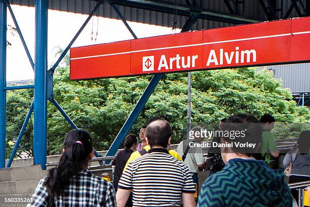 Passengers walk to the train station Arhur Alvim on January 29, 2013 in Sao Paulo, Brazil.