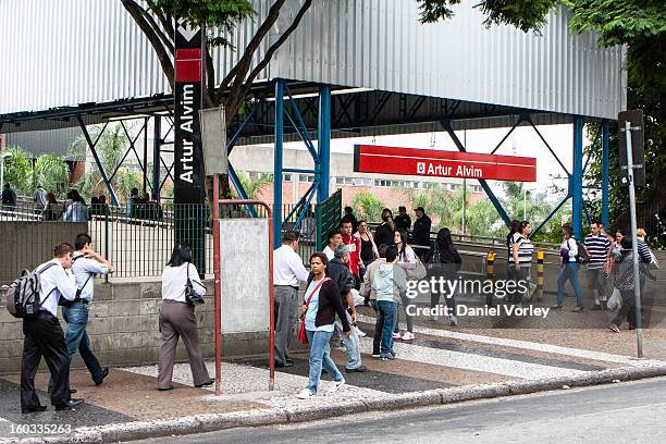 Passengers walk to the train station Arhur Alvim on January 29, 2013 in Sao Paulo, Brazil.