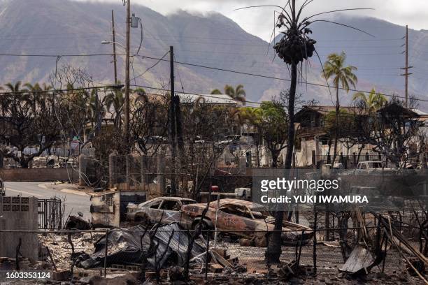 Destroyed buildings and cars are seen in the aftermath of the Maui wildfires in Lahaina, Hawaii on August 16, 2023. The number of people known to...