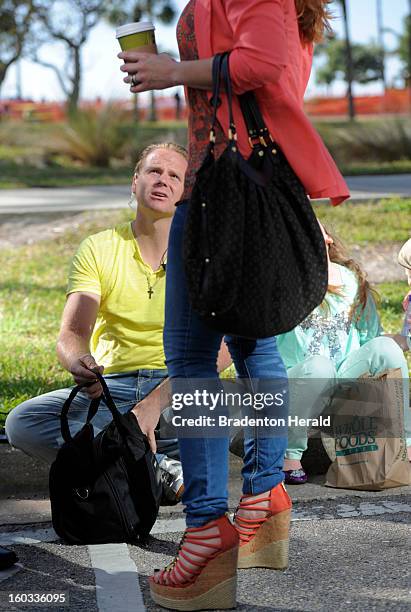 Aerialist Nik Wallenda looks up to his wife, Erendira, before his walk from a crane to the Marina Tower in downtown Sarasota, Florida, Tuesday...