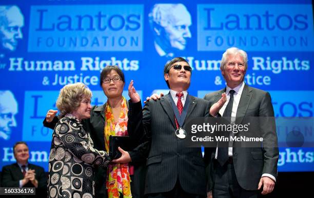 Actor Richard Gere stands with Chinese human rights activist Chen Guangcheng after Chen was awarded the 2012 Tom Lantos Human Rights Prize as Lantos'...
