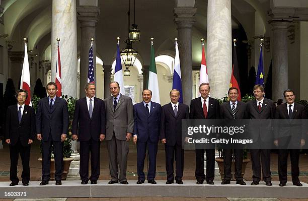 Leaders of the Group of Eight nations pose for a family photo July 22, 2001 at the G8 summit in Genoa, Italy. Left to right are Japanese Prime...
