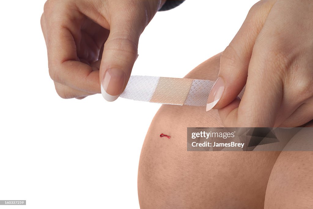 First Aid; Applying Bandage to Cut Knee