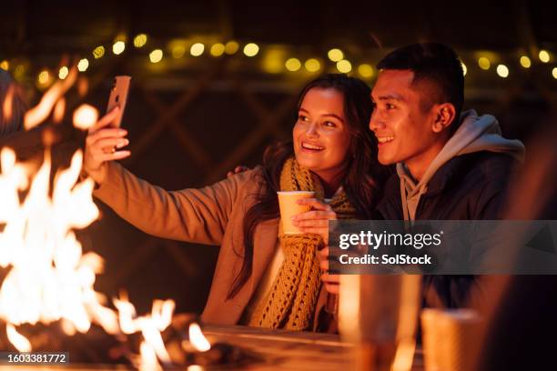 selfie by the firepit - fire pit stock pictures, royalty-free photos & images