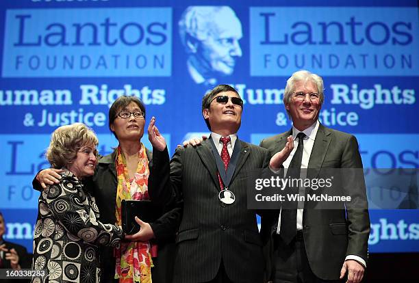 Actor Richard Gere stands with Chinese human rights activist Chen Guangcheng after Chen was awarded the 2012 Tom Lantos Human Rights Prize as Lantos'...