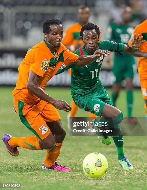 Joseph Musonda from Zambia and B Y Jonathan Pitroipa from Burkina Faso in action during the 2013 Orange African Cup of Nations match between Burkina...