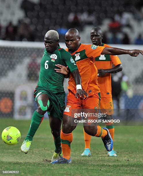 Burkina Faso's midfielder Djakaridja Kone fights for the ball with Zambia's forward Collins Mbesum during the Burkina Faso vs Zambia Africa Cup of...