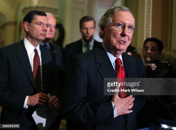 Senate Minority Leader Sen. Mitch McConnell , speaks to the media while flanked by Sen. John Barrasso , Senate Minority Whip Sen. John Cornyn , and...