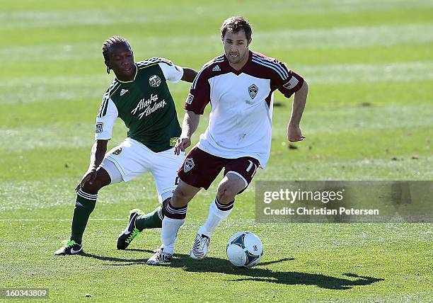 Brian Mullan of the Colorado Rapids controls the ball past Diego Chara of the Portland Timbers during The Desert Friendlies Presented By FC Tucson at...
