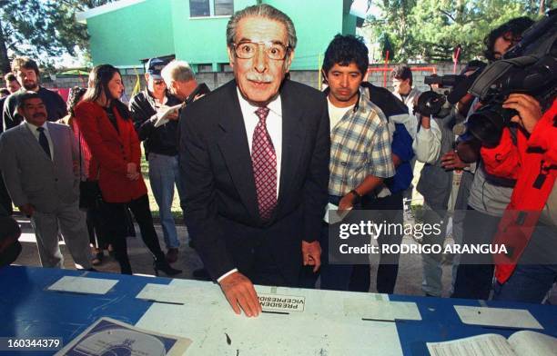 Former Guatemalan dictator Efrain Rios Montt casts his vote 26 December 1999 at a polling station in Guatemala City during the second round of...
