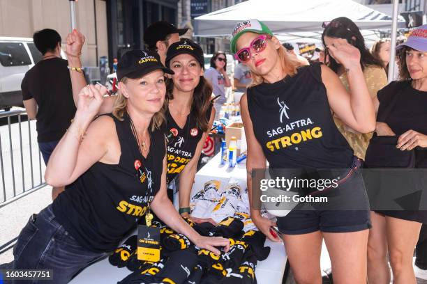 Samantha Mathis and Busy Philipps are seen walking the picket line during the SAG-AFTRA strike in Greenwich Village on August 09, 2023 in New York...