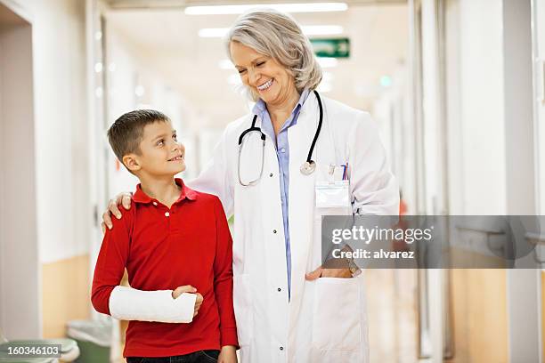 young boy recovering from a broken arm - armbrott bildbanksfoton och bilder