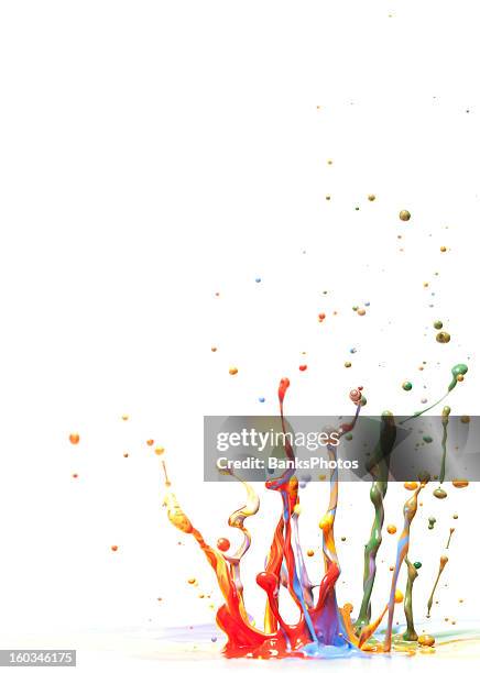 multicolor paint splash against a white background. - red paint splash stock pictures, royalty-free photos & images