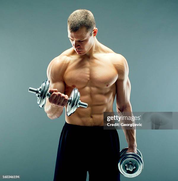 naked fitness guy in black shorts - pectoral muscle stock pictures, royalty-free photos & images