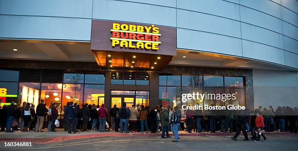 More than 200 people waited in the cold to be one of the first people to dine at Bobby Flay's newest location of Bobby's Burger Palace in the...