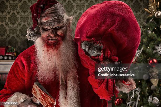 pictures of real santa zombie with victims - dirty santa stockfoto's en -beelden