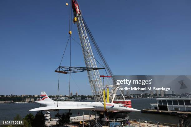 The British Airways Concorde is seen lifted by a crane at the Intrepid Museum on August 09, 2023 in New York City. The British Airways Concorde, the...