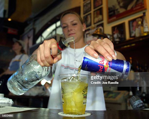 Sloppy Joe''s Bar Tender Crystal Petersen mixes a Red Bull energy drink with vodka July 22, 2001 in Key West, FL. The popular energy drink is now...