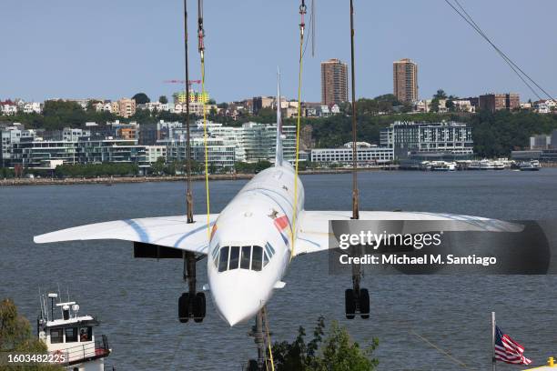 The British Airways Concorde is seen lifted by crane at the Intrepid Museum on August 09, 2023 in New York City. The British Airways Concorde, the...