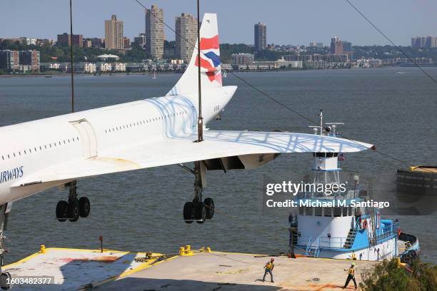 The British Airways Concorde is seen lifted by crane at the Intrepid Museum on August 09, 2023 in New York City. The British Airways Concorde, the...