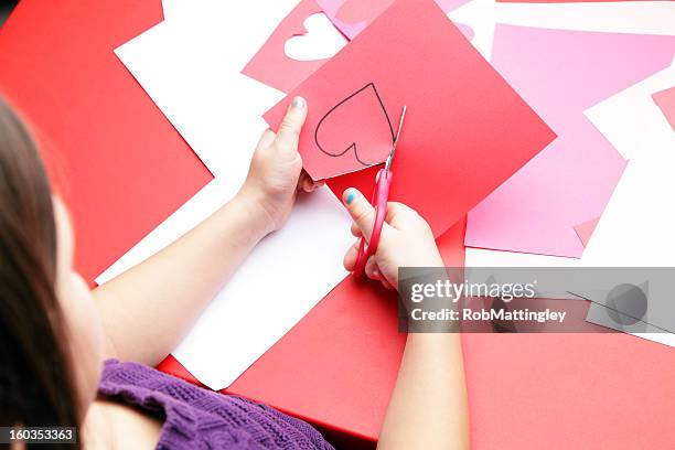 valentine's day craft - child cutting card stock pictures, royalty-free photos & images