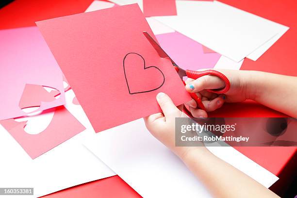 valentine's day craft - child cutting card stock pictures, royalty-free photos & images