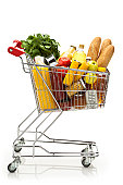 Side view of shopping cart filled with groceries and vegetables