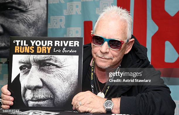 Eric Burdon poses with his album 'Til Your River Runs Dry' at J&R Music World on January 29, 2013 in New York City.