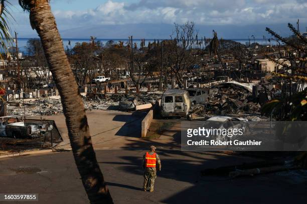 Lahaina, Maui, Wednesday, August 16, 2023 - A national guardsman patrols Nahale St. Where numerous homes lay in ruins after last week's devastating...