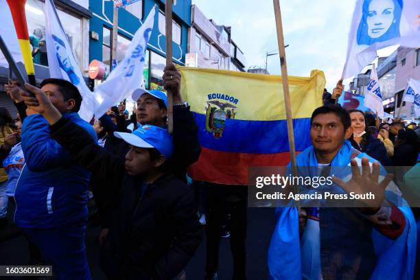 Supporters of Luisa Gonzalez presidential candidate for Revolución Ciudadana coalition shout slogans during a campaign closing rally on August 16,...