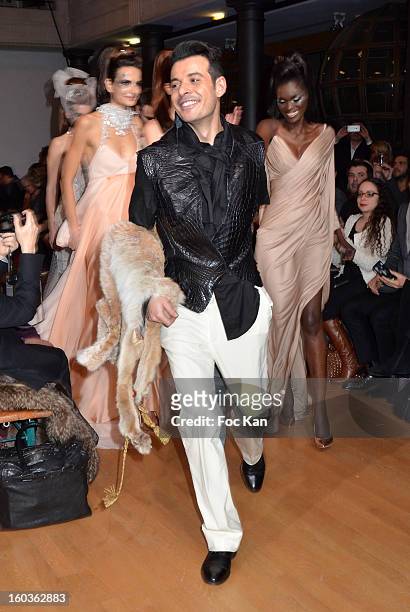 Eric Tabusch and models attend the Eric Tibusch Spring/Summer 2013 Haute-Couture show as part of Paris Fashion Week at Hotel D'Evreux on January 21,...