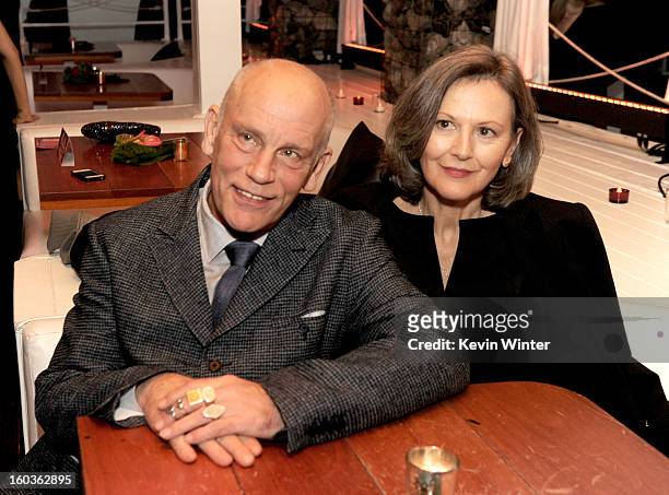 Actor John Malkovich and his wife Nicoletta Peyran pose at the after party for the premiere of Summit Entertainment's "Warm Bodies" at The Colony on...