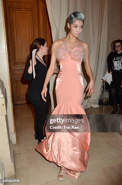 Model leaves the backstage for the runway during the Alexis Mabille Spring/Summer 2013 Haute-Couture show as part of Paris Fashion Week at Mairie du...