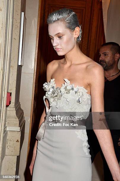 Model leaves the backstage for the runway during the Alexis Mabille Spring/Summer 2013 Haute-Couture show as part of Paris Fashion Week at Mairie du...