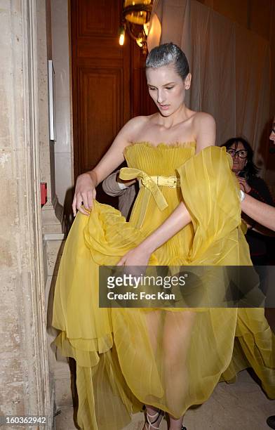 Model leaves the backstage for the runway during the Alexis Mabille Spring/Summer 2013 Haute-Couture show as part of Paris Fashion Week at Mairie du...