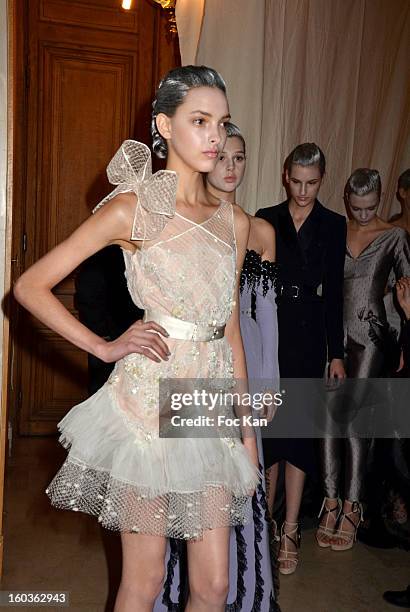 Model leaves the backstage for the runway during the Alexis Mabille Spring/Summer 2013 Haute-Couture show as part of Paris Fashion Week at Mairie du...