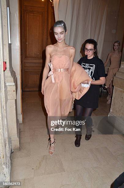 Model leaves the backstage for the runway during the Alexis Mabille Spring/Summer 2013 Haute-Couture show as part of Paris Fashion Week at Mairie du...