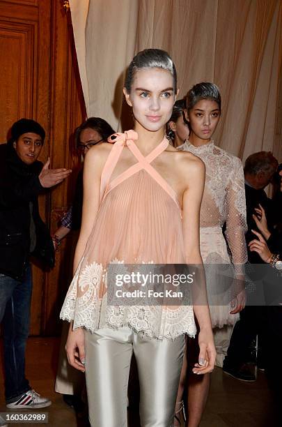 Model leaves the backstage for the runway during the Alexis Mabille Spring/Summer 2013 Haute-Couture show as part of Paris Fashion Week at Mairie du...