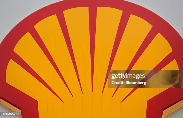 The Royal Dutch Shell Plc company logo is seen above the entrance to a gas station in London, U.K., on Tuesday, Jan. 29, 2013. Oil traded near the...