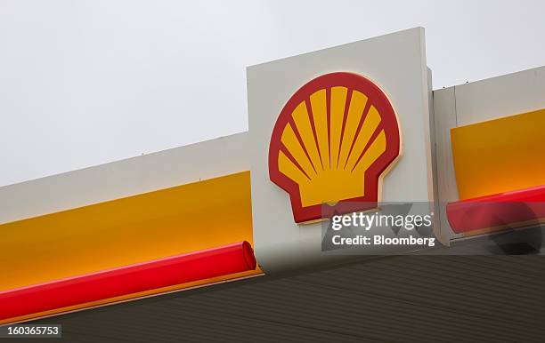 The Royal Dutch Shell Plc company logo is seen above the entrance to a gas station in London, U.K., on Tuesday, Jan. 29, 2013. Oil traded near the...