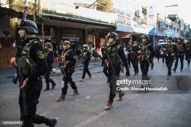 Members of the Al-Quds Brigades, the military wing of the Islamic Jihad movement, march during a military parade on August 9, 2023 in the city of...