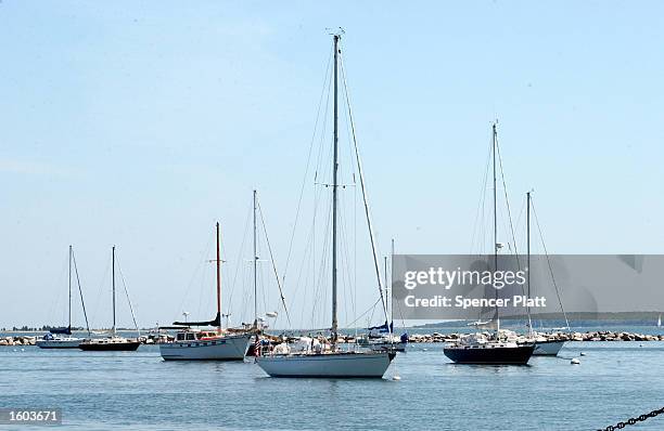 Boats sit in the harbor July 21, 2001 in Sag Harbor, NY. The Hamptons, located at the east end of New York''s Long Island, is a traditional summer...