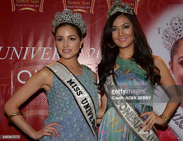 Miss Universe 2012 Olivia Culpo of the US and Indonesian Putri Indonesia 2011 Maria Selena attend a promotional event in Jakarta on January 30, 2013....